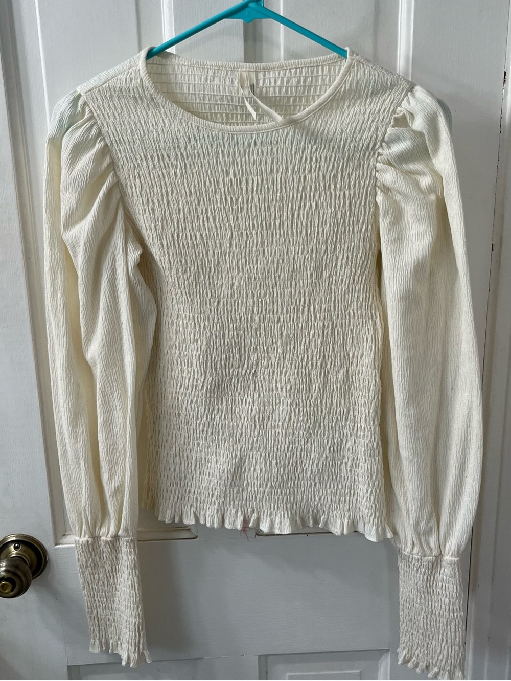 Romantic  Smocked Puff-Sleeved Top in ivory by Anthropologie. . Size Small